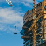 Tower cranes over a residential building under construction