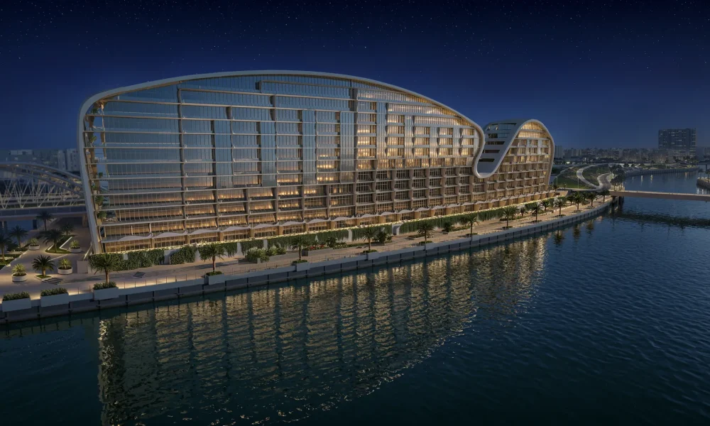 Hilton Residences Al Raha on the waterfront at night